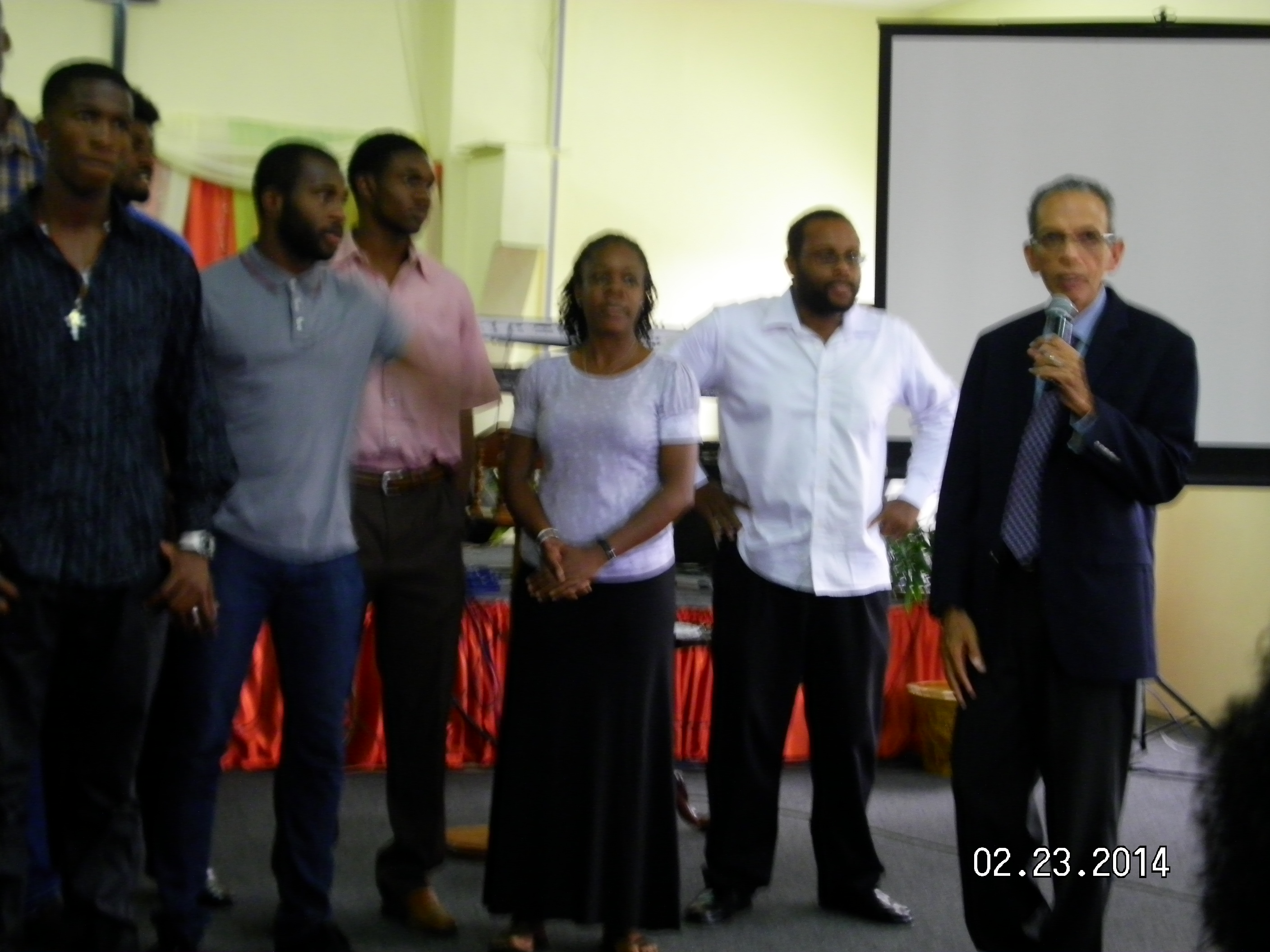 Pastor Muirhead, far right with Manager, Dane Kelly (second right) and Assistant Manager, Juline Holness (third right)