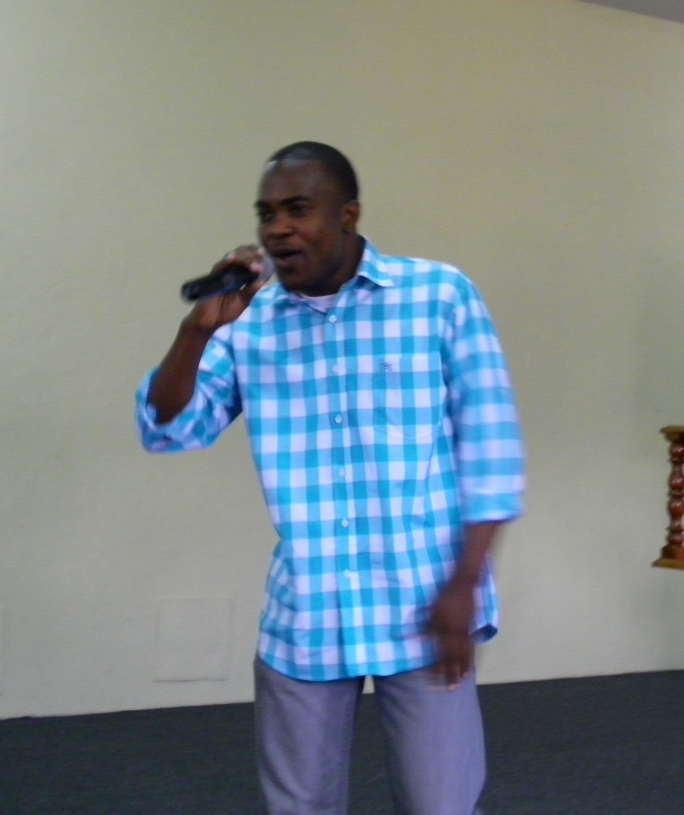 Brother Elijah challenging the youths in song